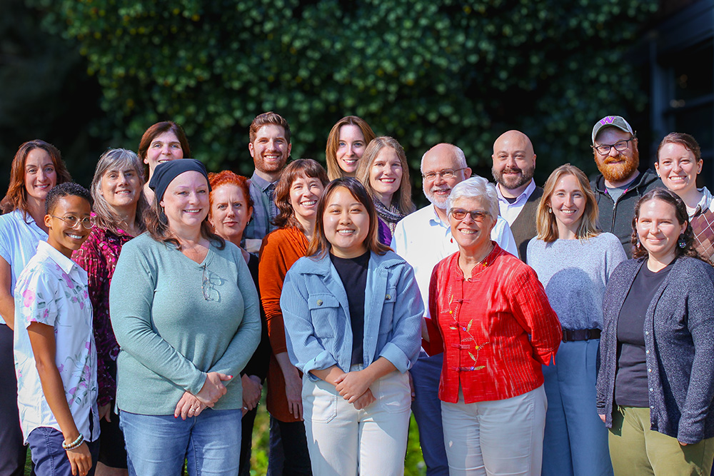 Group photo of all staff at NWCPHP standing outside and smiling