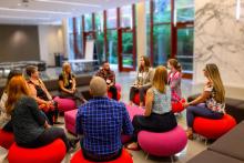 Scholars in discussion at an on-site session