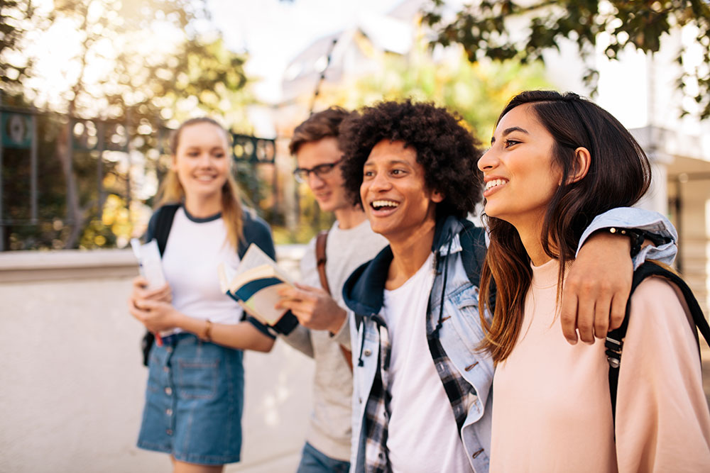 Photograph of several teens hanging out.