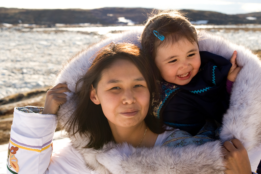 Photograph of an AI/AN woman and young child.